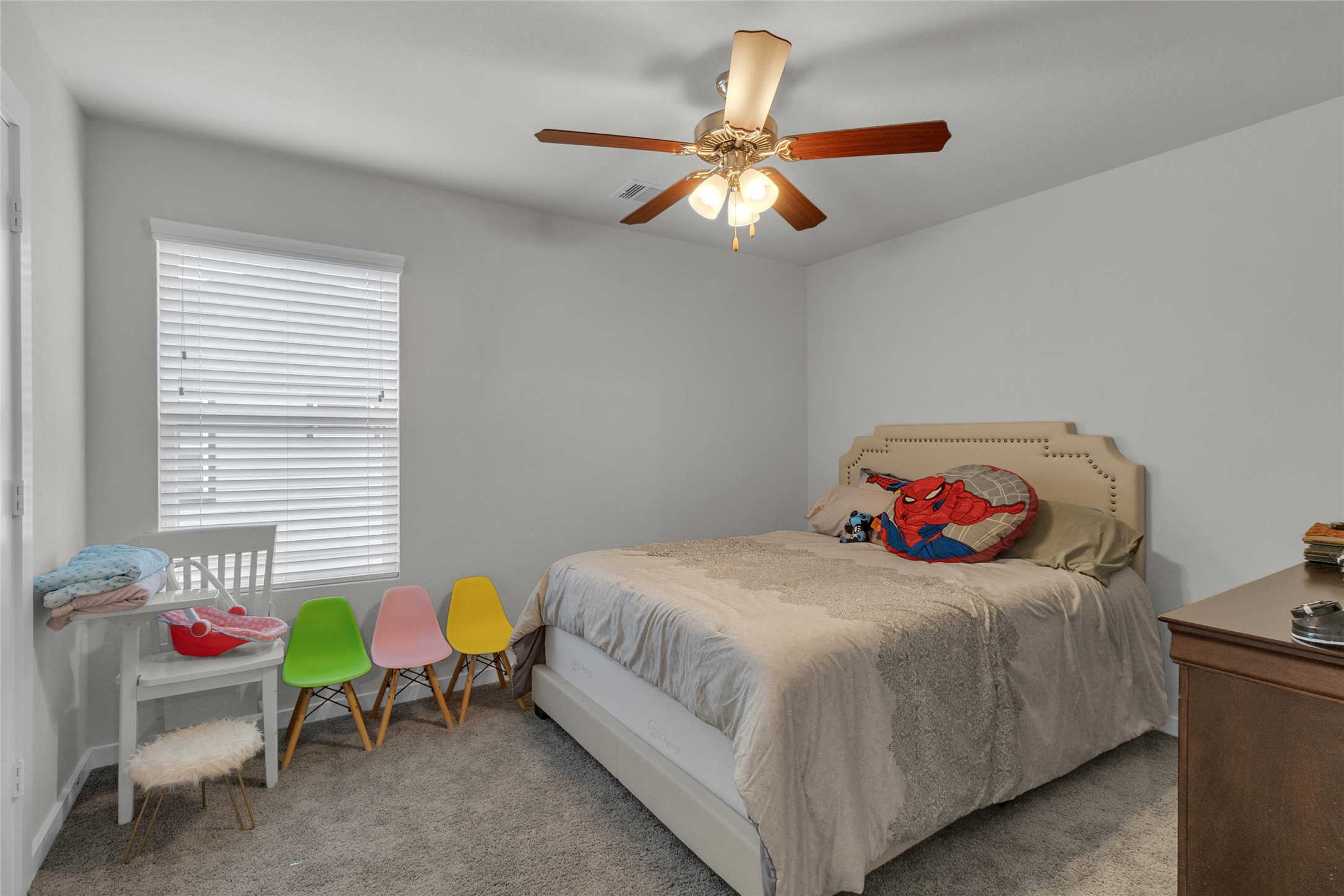 2314 Village Side Trail Rosenberg, TX 77471 - Photo 23 of 31 a bedroom with a bed and a chandelier