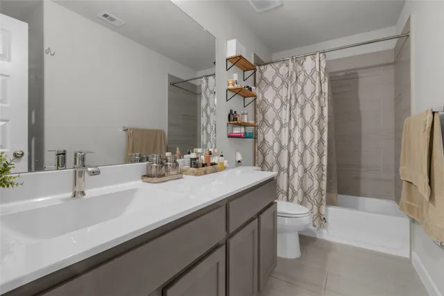 a bathroom with a sink a toilet and a bathtub