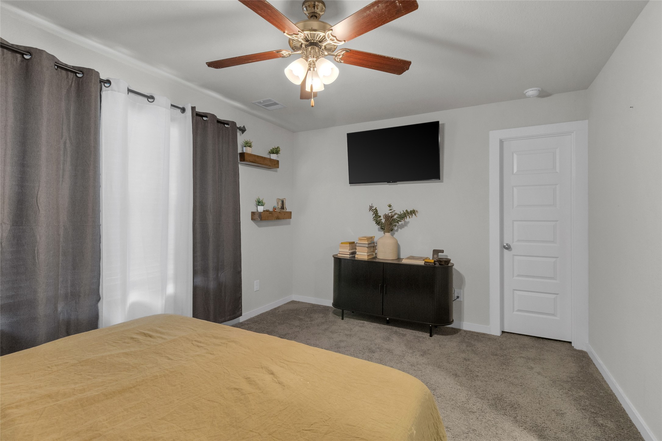 2314 Village Side Trail Rosenberg, TX 77471 - Photo 26 of 31 a bedroom with a bed and a flat screen tv