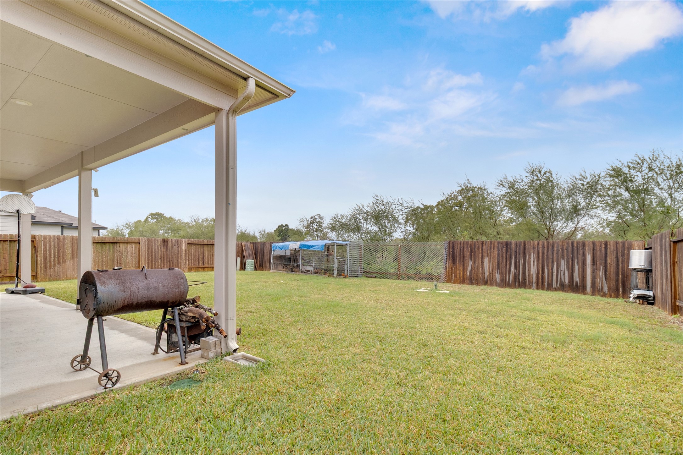 2314 Village Side Trail Rosenberg, TX 77471 - Photo 29 of 31 a view of a backyard with sitting area