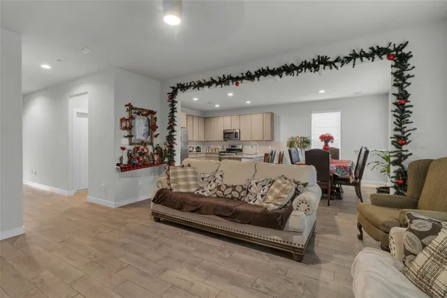 a living room with furniture and flowers