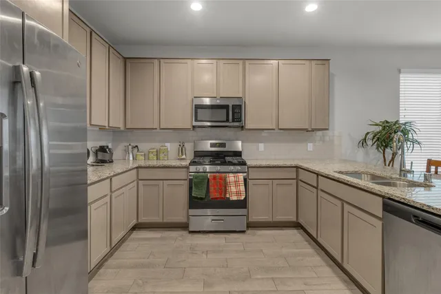 a kitchen with a sink and cabinets
