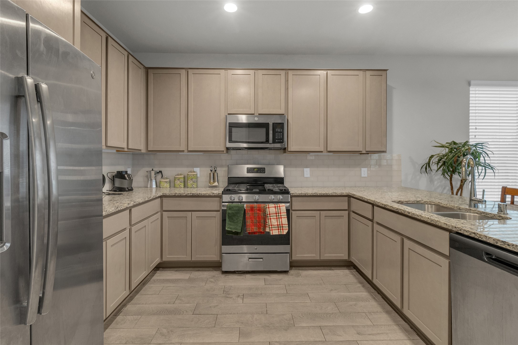 2314 Village Side Trail Rosenberg, TX 77471 - Photo 9 of 31 a kitchen with a sink and cabinets