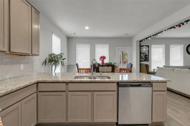 a kitchen with cabinets a sink and dishwasher