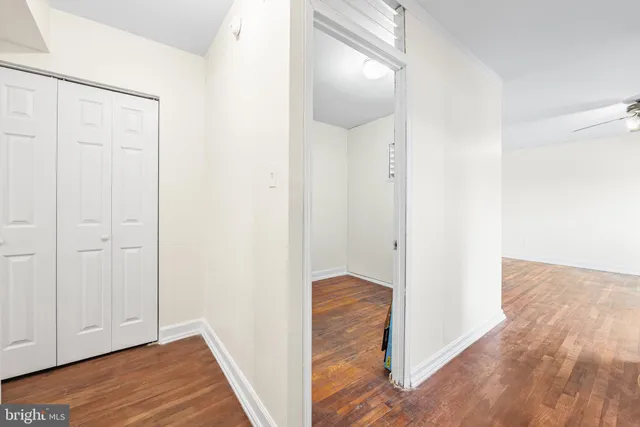 a view of kitchen with furniture and refrigerator
