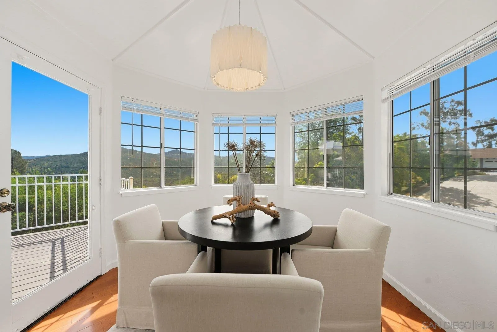 3132 Don Rolando Escondido, CA 92025 - Photo 17 of 56 a dining room with furniture a chandelier and wooden floor