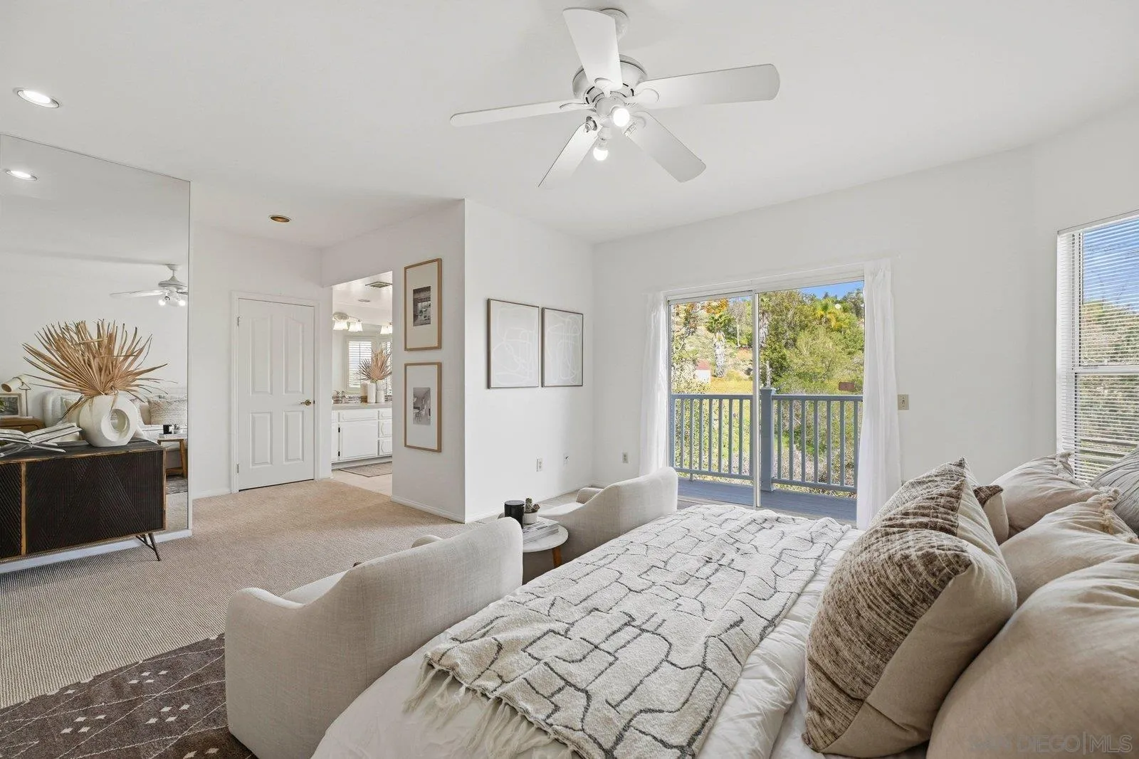 3132 Don Rolando Escondido, CA 92025 - Photo 22 of 56 a spacious bedroom with a large bed and a chandelier