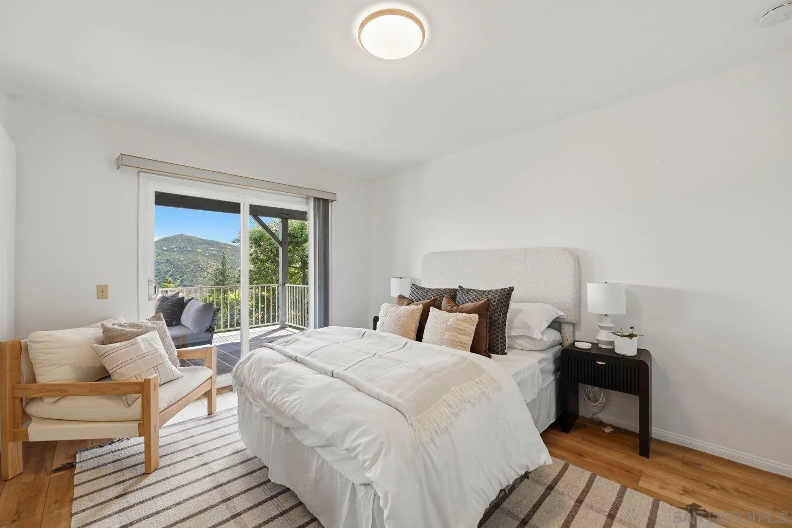 3132 Don Rolando Escondido, CA 92025 - Photo 30 of 56 a bedroom with a bed and wooden floor