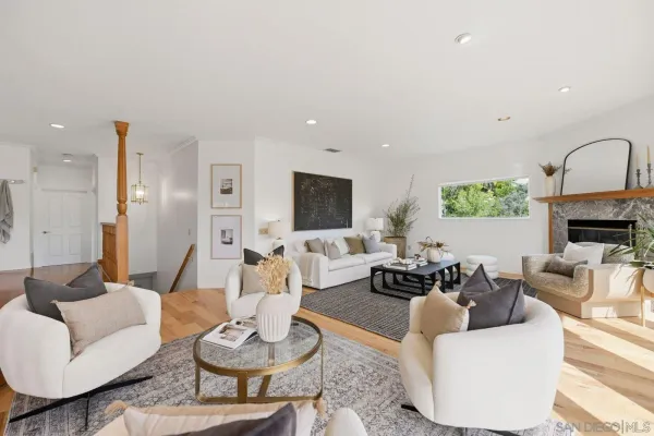 a living room with fireplace furniture and a fireplace