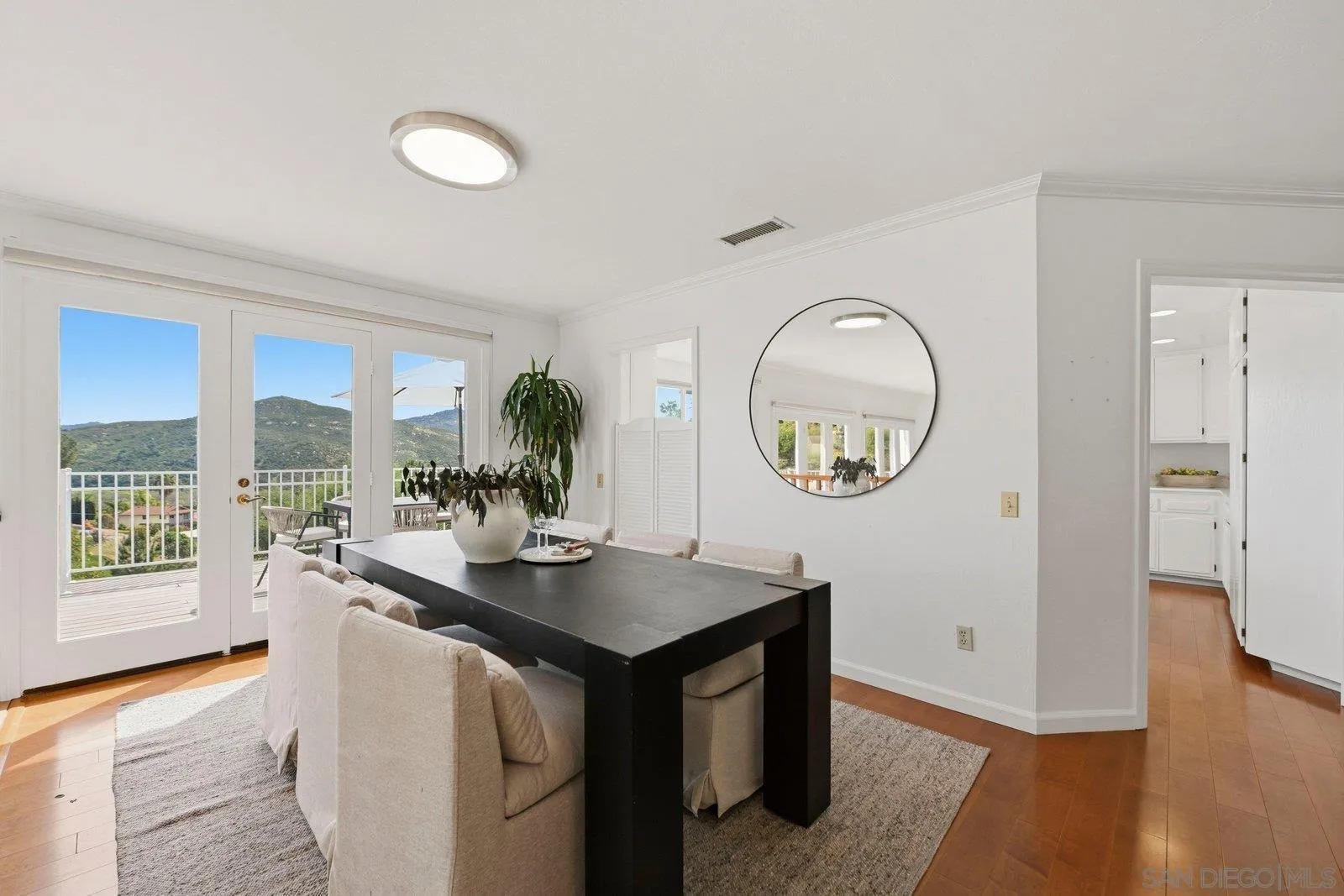 3132 Don Rolando Escondido, CA 92025 - Photo 8 of 56 a view of kitchen island with wooden floor and outdoor view