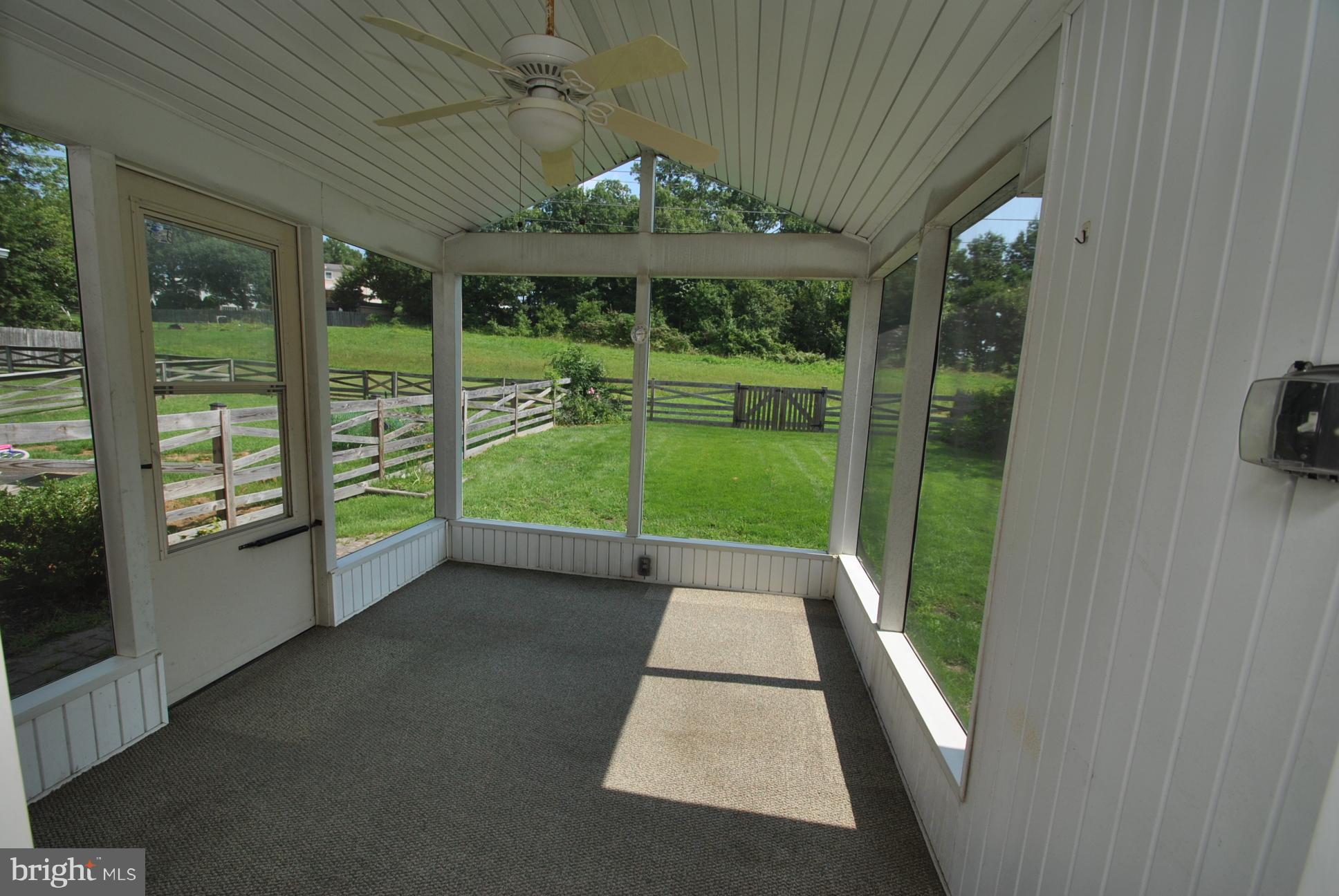 8617 Heathermill Road Baltimore, MD 21236 - Photo 19 of 20 SCREENED IN EXTERIOR PORCH - BACKS TO OPEN SPACE