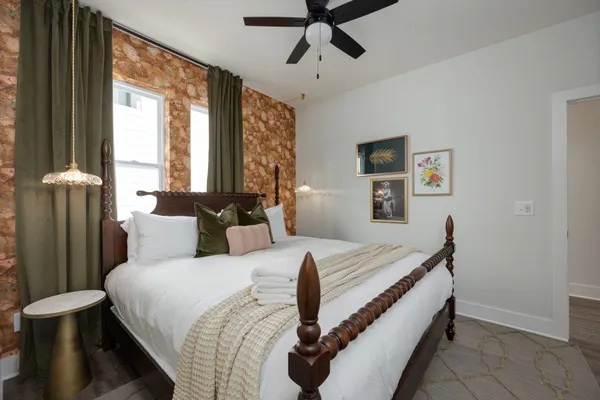 a bedroom with a bed and a window