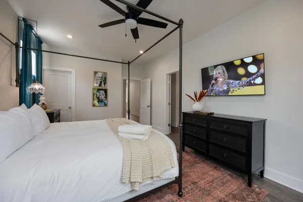 a bedroom with a bed and a dresser