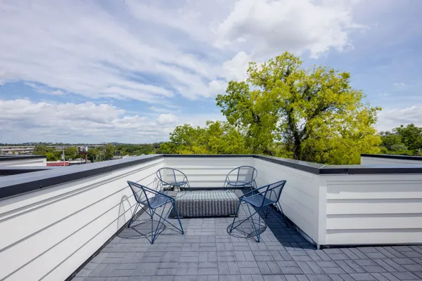 a view of balcony with furniture