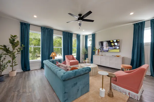 a living room with furniture and a large window