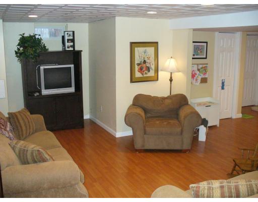 3 Ayer Road Littleton, MA 01460 - Photo 11 of 24 a living room with furniture and a flat screen tv