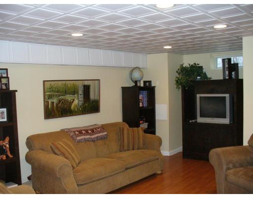 3 Ayer Road Littleton, MA 01460 - Photo 12 of 24 a living room with furniture and a flat screen tv