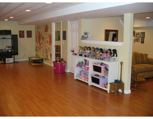 3 Ayer Road Littleton, MA 01460 - Photo 13 of 24 a living room with furniture and a flat screen tv