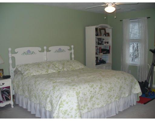 3 Ayer Road Littleton, MA 01460 - Photo 17 of 24 a large bed sitting in a bedroom and closet
