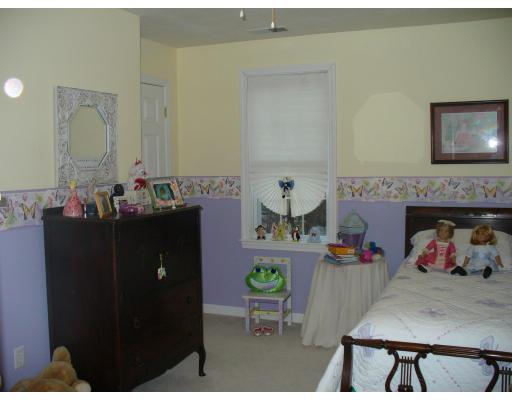 3 Ayer Road Littleton, MA 01460 - Photo 19 of 24 a bedroom with a bed a table and chair
