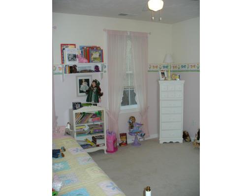 3 Ayer Road Littleton, MA 01460 - Photo 20 of 24 a view of a bedroom with baby toys