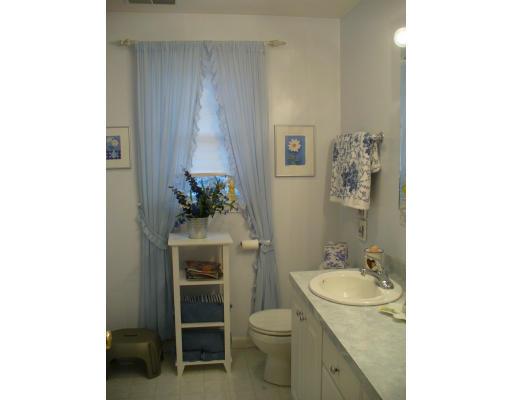 3 Ayer Road Littleton, MA 01460 - Photo 22 of 24 a bathroom with a granite countertop sink a toilet and a mirror
