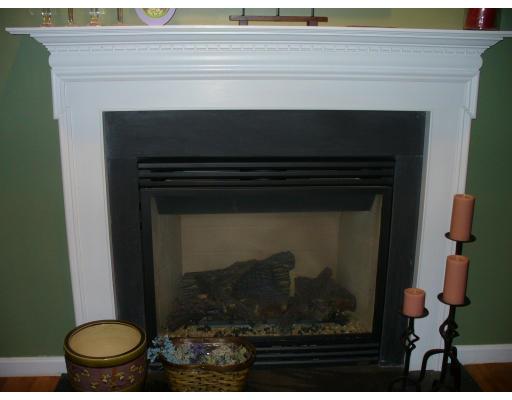 3 Ayer Road Littleton, MA 01460 - Photo 6 of 24 a living room with a fireplace