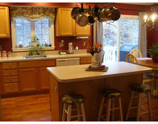 3 Ayer Road Littleton, MA 01460 - Photo 7 of 24 a kitchen with a sink cabinets and a large window