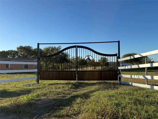 a view of swimming pool with an outdoor seating