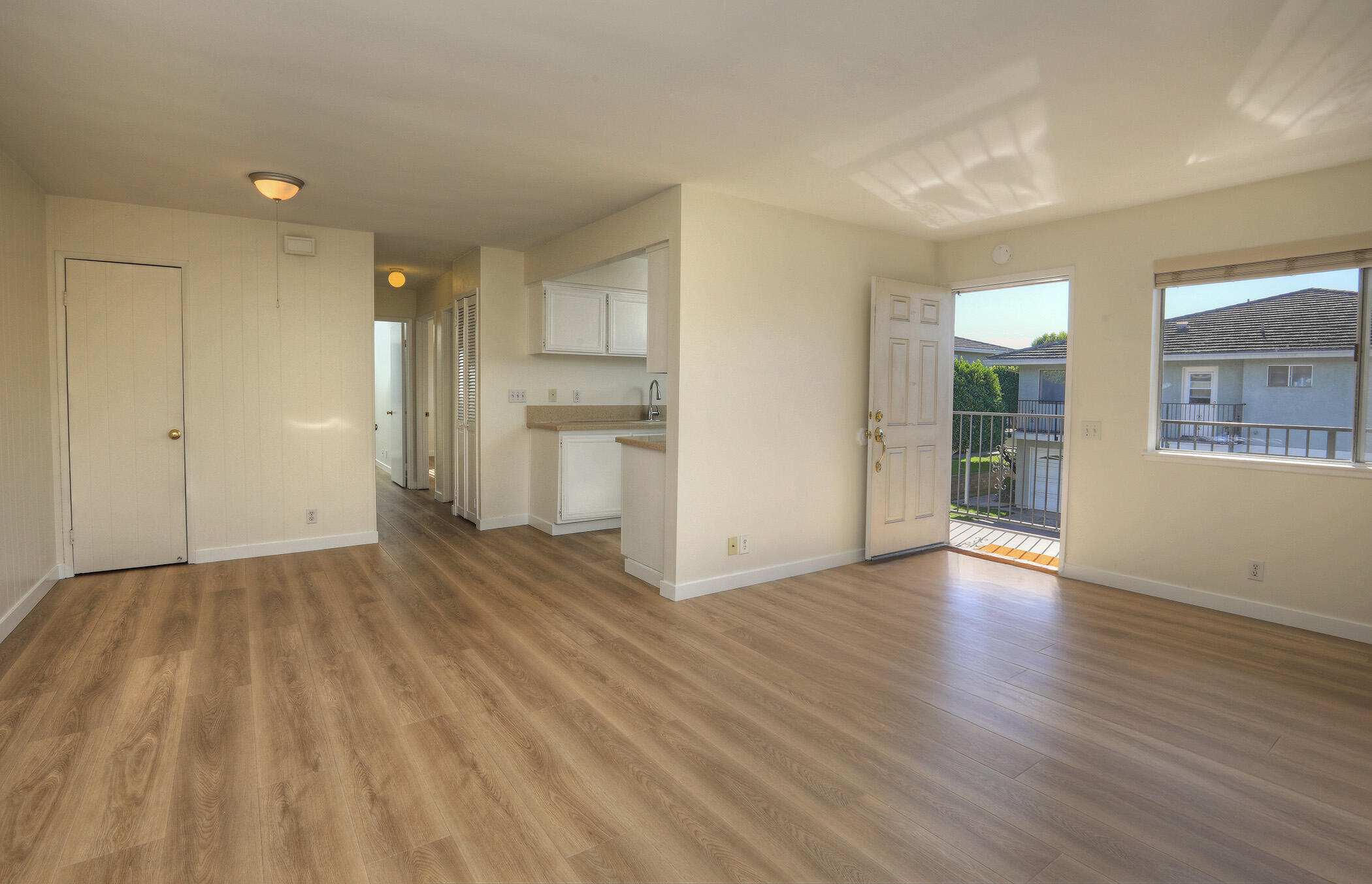 5945 Hickory Street, Unit 4 Carpinteria, CA 93013 - Photo 1 of 19 an empty room with wooden floor and windows