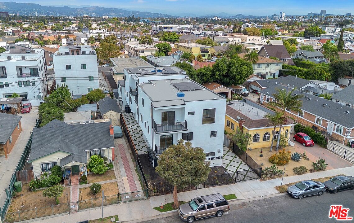 4703 Saturn Street Los Angeles, CA 90019 - Photo 2 of 37 an aerial view of residential houses with outdoor space