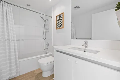 a bedroom with a bed and a mirror