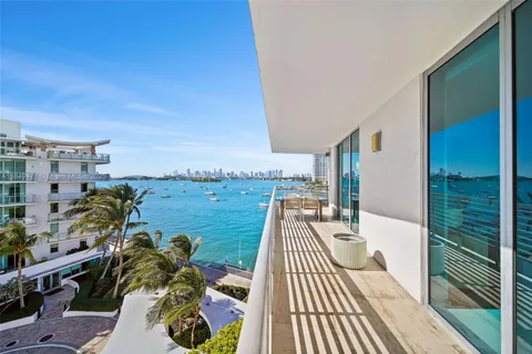 an aerial view of a house with outdoor space lake view and lake view