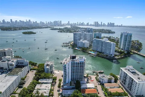 a view of a lake with tall buildings