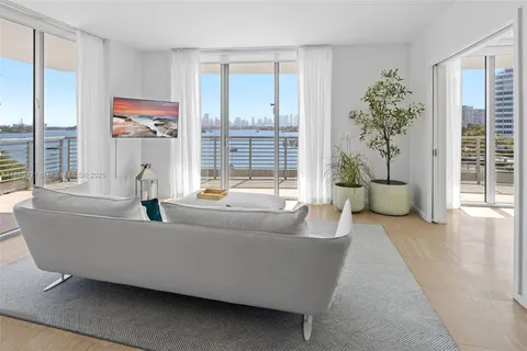 a view of a terrace with outdoor seating and city view