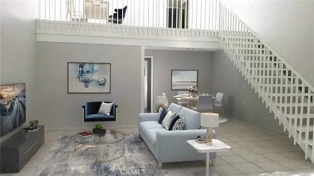 a living room with furniture a rug and white walls