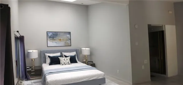 a bed room with a bed and a painting on the wall