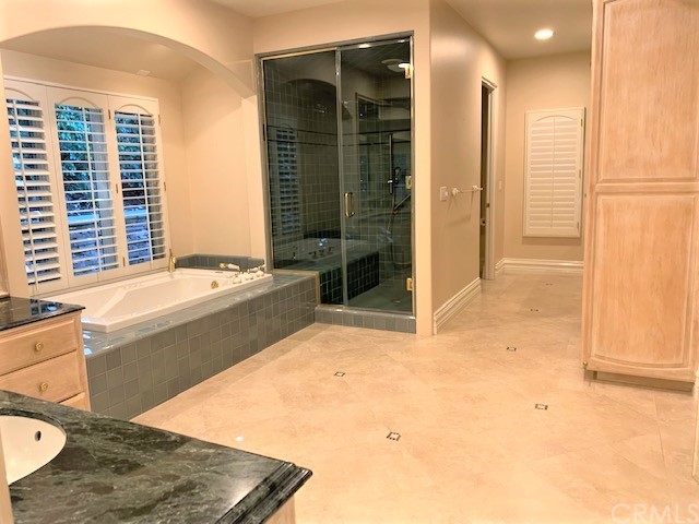 3930 Coral Place Calabasas, CA 91302 - Photo 19 of 50 a view of bathroom with tub shower and mirror