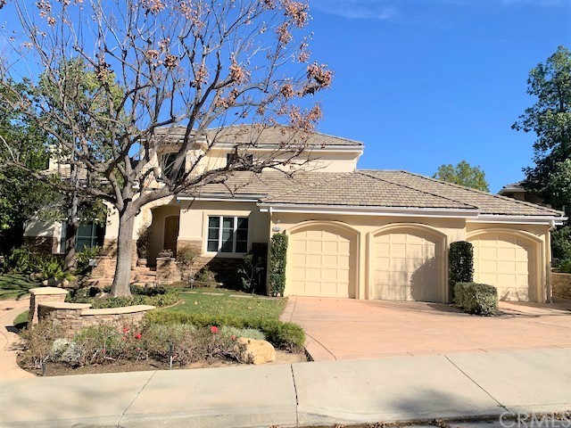 3930 Coral Place Calabasas, CA 91302 - Photo 2 of 50 a front view of a house with garden