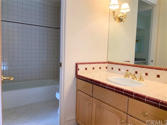 3930 Coral Place Calabasas, CA 91302 - Photo 28 of 50 a bathroom with a tub and a sink