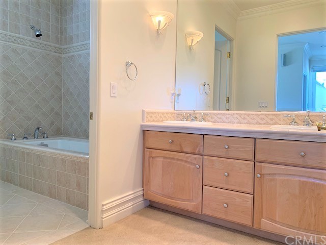 3930 Coral Place Calabasas, CA 91302 - Photo 36 of 50 a bathroom with a granite countertop sink and a mirror