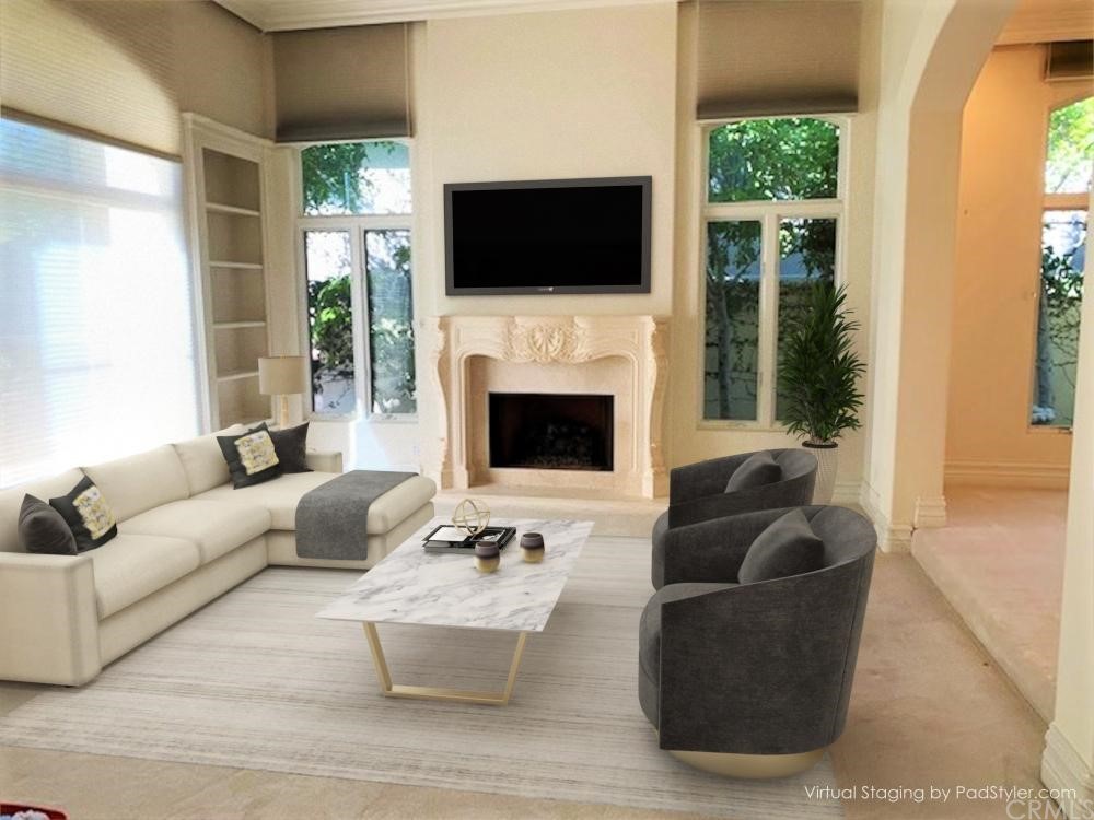 3930 Coral Place Calabasas, CA 91302 - Photo 6 of 50 a living room with furniture a fireplace and a flat screen tv