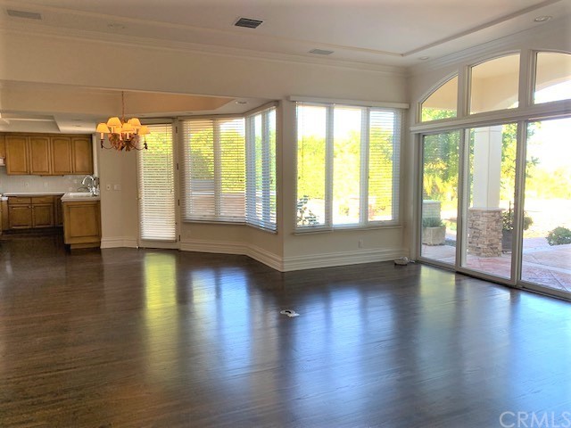 3930 Coral Place Calabasas, CA 91302 - Photo 10 of 50 a view of an empty room with wooden floor and a window