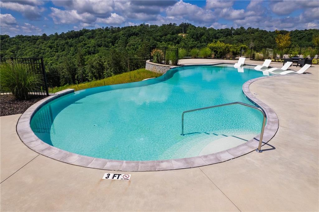 290 Anglers Ridge Road Talking Rock, GA 30175 - Photo 22 of 29 a view of a swimming pool with a yard and a garden