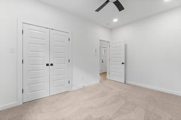 an empty room with closet area