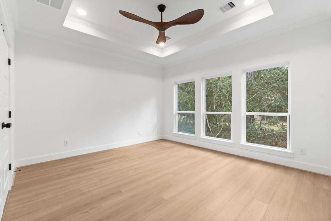 34 Cottonwood Trinity, TX 75862 - Photo 22 of 44 an empty room with a window and a ceiling fan