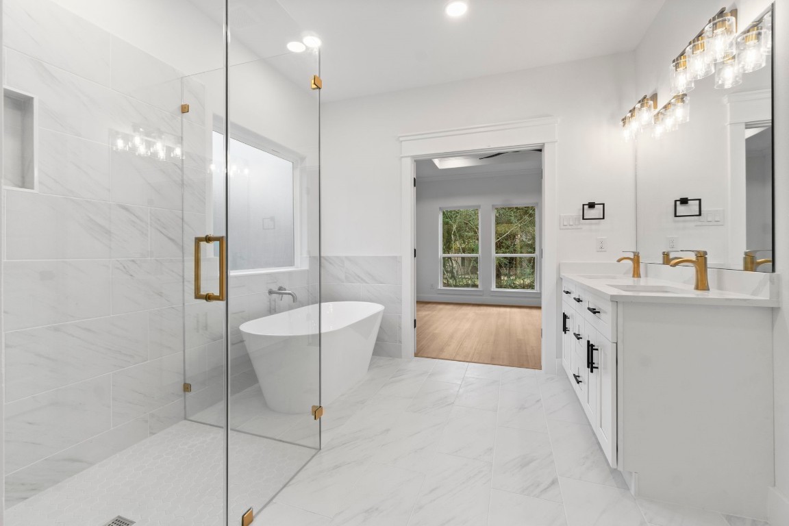 34 Cottonwood Trinity, TX 75862 - Photo 25 of 44 a bathroom with a tub sink and mirror