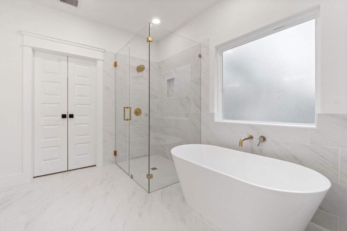 34 Cottonwood Trinity, TX 75862 - Photo 27 of 44 a white bath tub sitting next to a white toilet