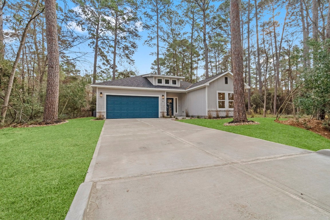 34 Cottonwood Trinity, TX 75862 - Photo 35 of 44 front view of a house with a yard and an trees