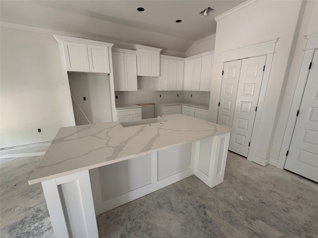 34 Cottonwood Trinity, TX 75862 - Photo 41 of 44 a spacious bedroom with a bed and a cabinets